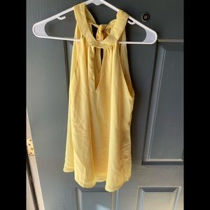 Women’s halter tank top. Sz Small. Tie-neck closure. Yellow. New without tags.